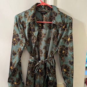 Green dress with black and gold flowers with belt size medium